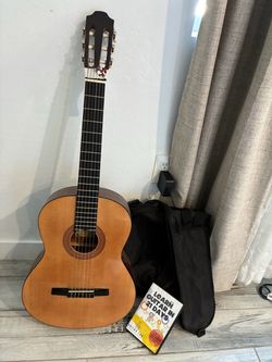 Guitar, case and learning cd.