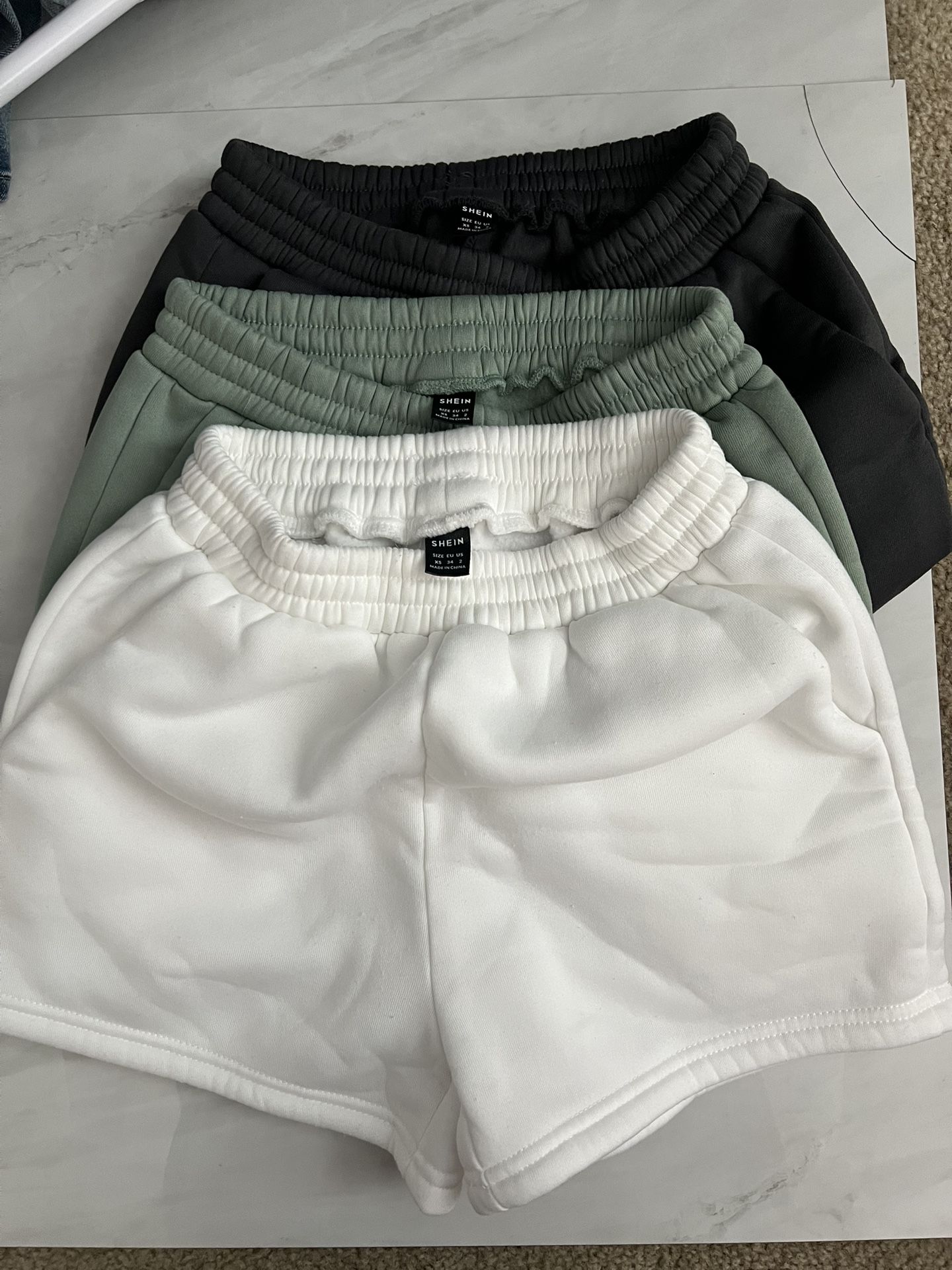 Shein 3 pairs of shorts in white, grey and light green
