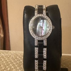 Beautiful Elgin women's EG8061K dress watch featuring a black ceramic insert bracelet and a diamond bezel. 