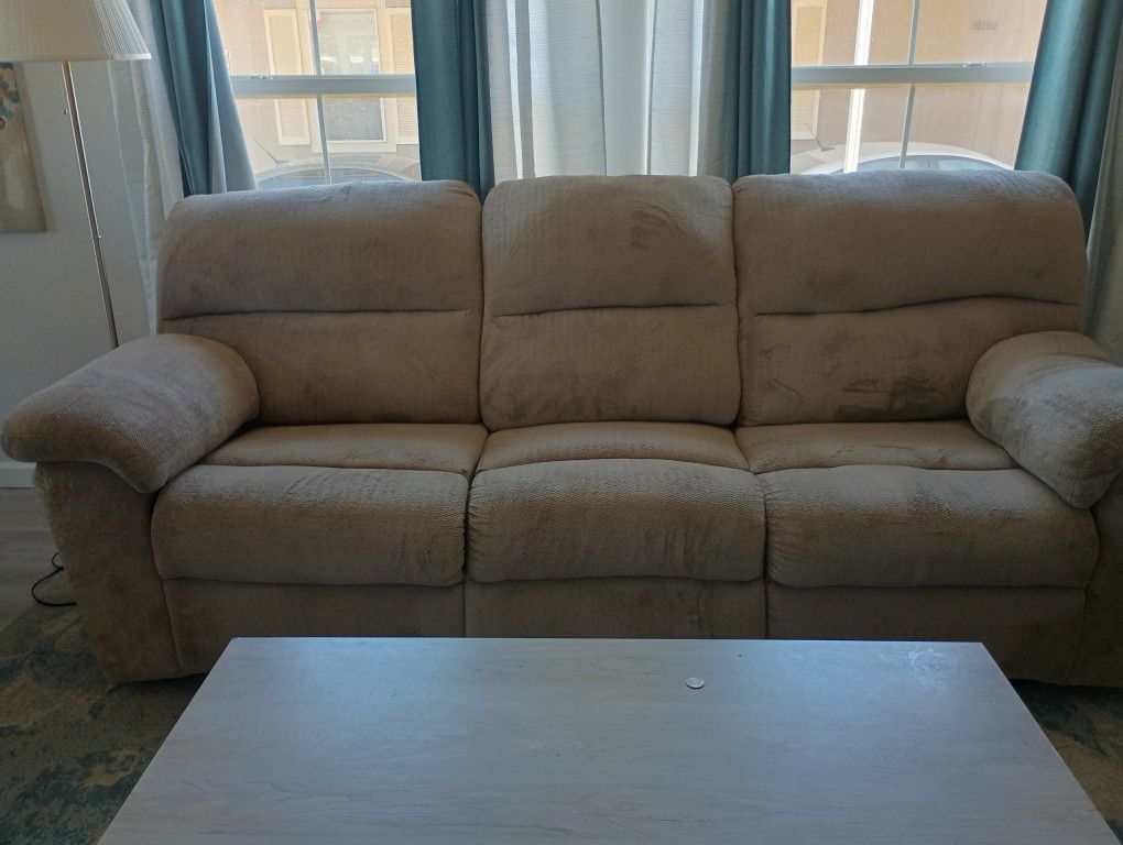 Double reclining sofa. Fair condition, see cat damage.