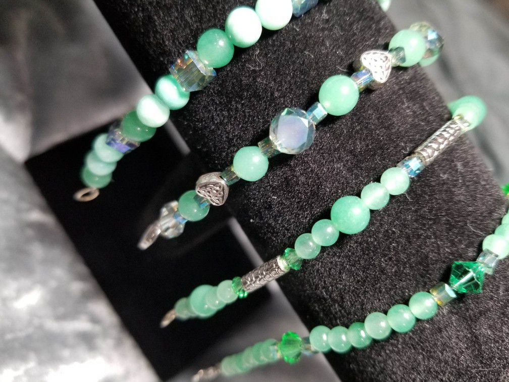 Assorted green gemstone bracelets (green adventurine and jade with czech glass and Swarovski beads).
Size small.
Clasp closure and stretch available. 
