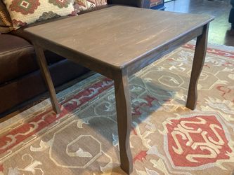 Stately coffee or end table made of solid wood- with classic lines and scalloped legs