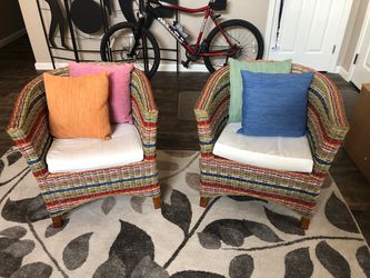 Two Festive Wicker chairs / colorful cushions in excellent clean condition