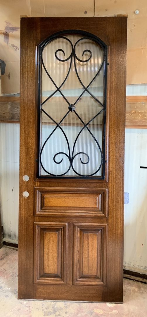 NEW front door with beautiful rough iron design and opaque rippled glass. $ 750 solid wood door, 36 by 96, 3 foot by 8 foot. No installs, only selli