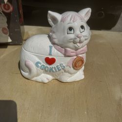 I Love Cookies" kitten cookie jar features a white cat wearing a pink apron and measures approximately 10.6 inches tall