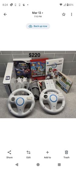 NINTENDO WII with 4 Games, 2 Controllers, 2 Wheels