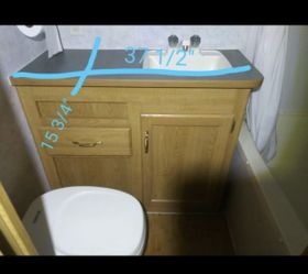 RV trailer vanity bathroom with sink and faucet