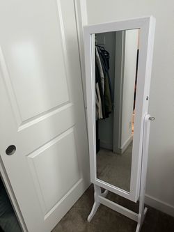 Jewelry storage mirror