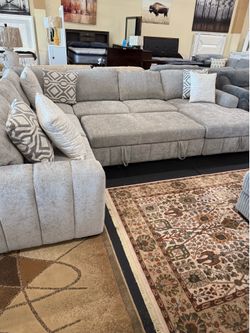 4 Piece Sectional with pullout bed & Storage Chaise On