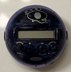 Radica 20Q Twenty Questions Handheld Electronic Game Purple