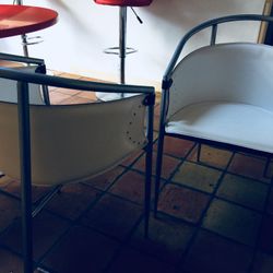 4 designer mid century steel and white leather chairs