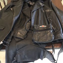 Woman’s Harley Davidson Leather Jacket, Chaps, Vest, Purse and T-Shirts. 