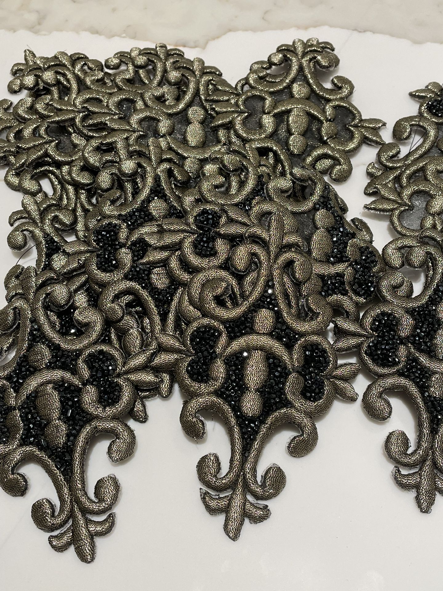 21 Appliqués In Black And Gold
