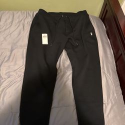 Black polo suit with zip up hoodie and sweats.