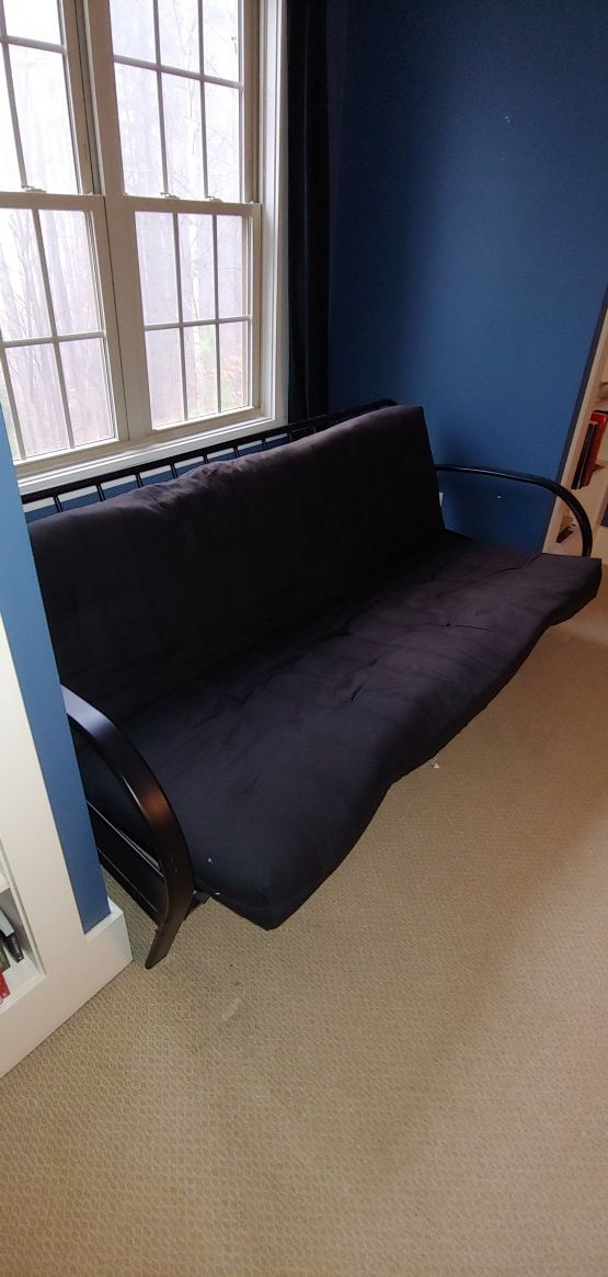 Futon Black in color with black mattress