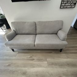 Small Couch Used For Staging 
