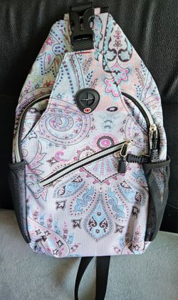 2                  This MOSISO Sling Backpack features a vibrant paisley pattern in
