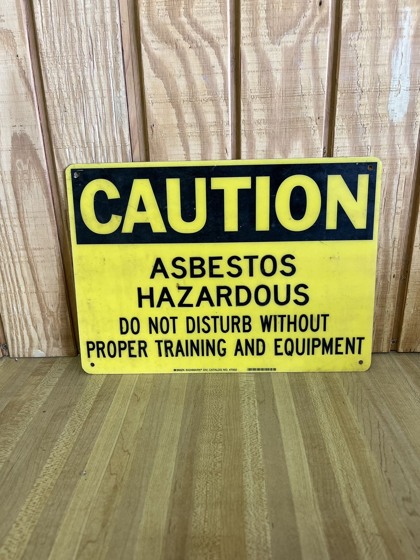 Caution Asbestos Hazardous Do Not Disturb sign