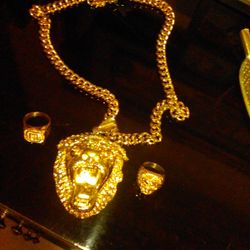 14 K Gold Plated  Cuban Chain With The Mean Lion Head,plus Have The Two Rings To Go with It