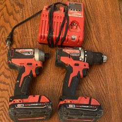 Milwaukee Drill And Impact. Two small batteries and charger