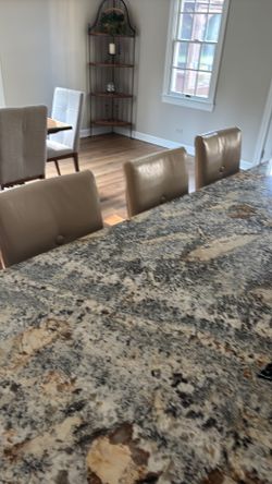 Three counter height padded Stools