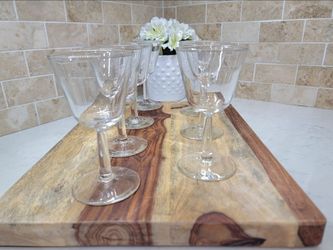 Set of 7 vintage clear glass stemmed glasses featuring a wide-mouthed bowl. These glasses are styled as cordial glasses, suitable for serving liqueurs