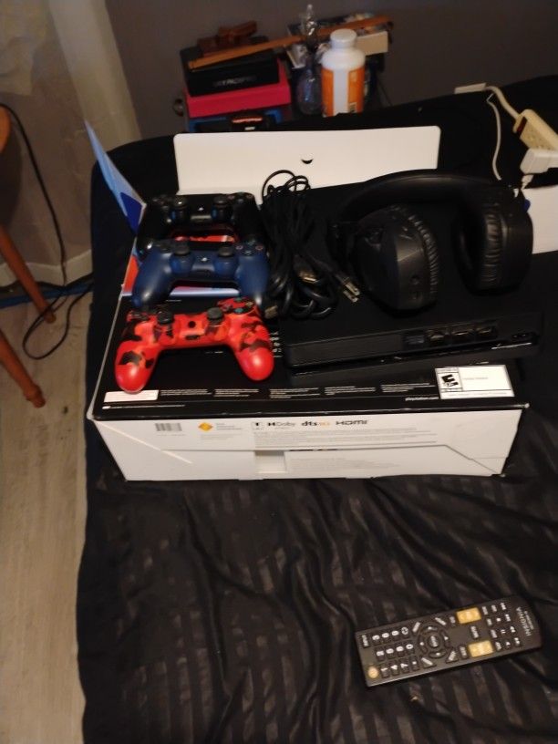 PlayStation 4 With Headphones And Grand Theft Auto Disc With It And Three Controls