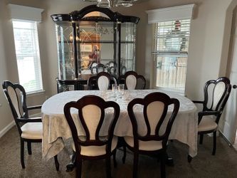 Beautiful cherrywood dinette set and glass hutch.