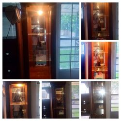 A Set Of Curio Cabinets Light It With Mirrors And Glass Shelves