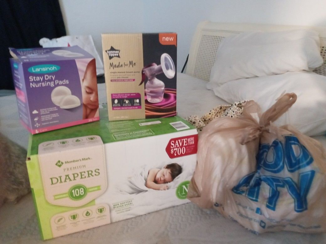 Newborn diapers , nursing pads , breast pump brand new never used , a bag of newborn diapers FREE