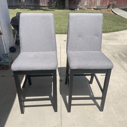 4 grey and black table chairs