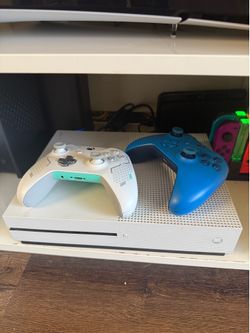 Microsoft Xbox One S console, controllers, and games