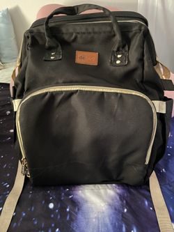 Diaper bag with changing table