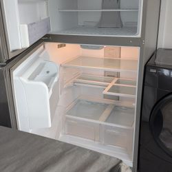 Whirlpool stainless steel refrigerator 33 in by 66 and a half inch tall by 31 in deep