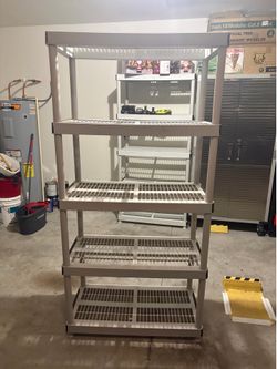 Durable 5-tier shelving unit is made of heavy-duty plastic.
