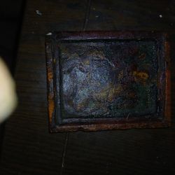two small, antique Orthodox Christian icons, likely a diptych or two individual micro icons. 
Subject Matter: The top ico
