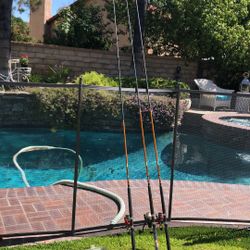 Three Freshwater Spinning Rods that are 11’-12’ tall with spinning reels plus 100’s of Jigs,Hooks & 