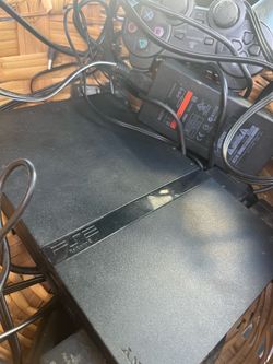 Slim PlayStation two with five games