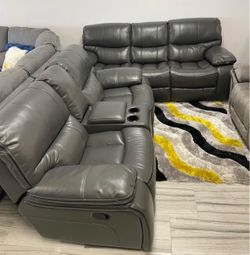 Warehouse liquidation sale. Madrid, gray leather reclining sofa and loveseat set now $1099. Easy finance option. Same-day delivery.