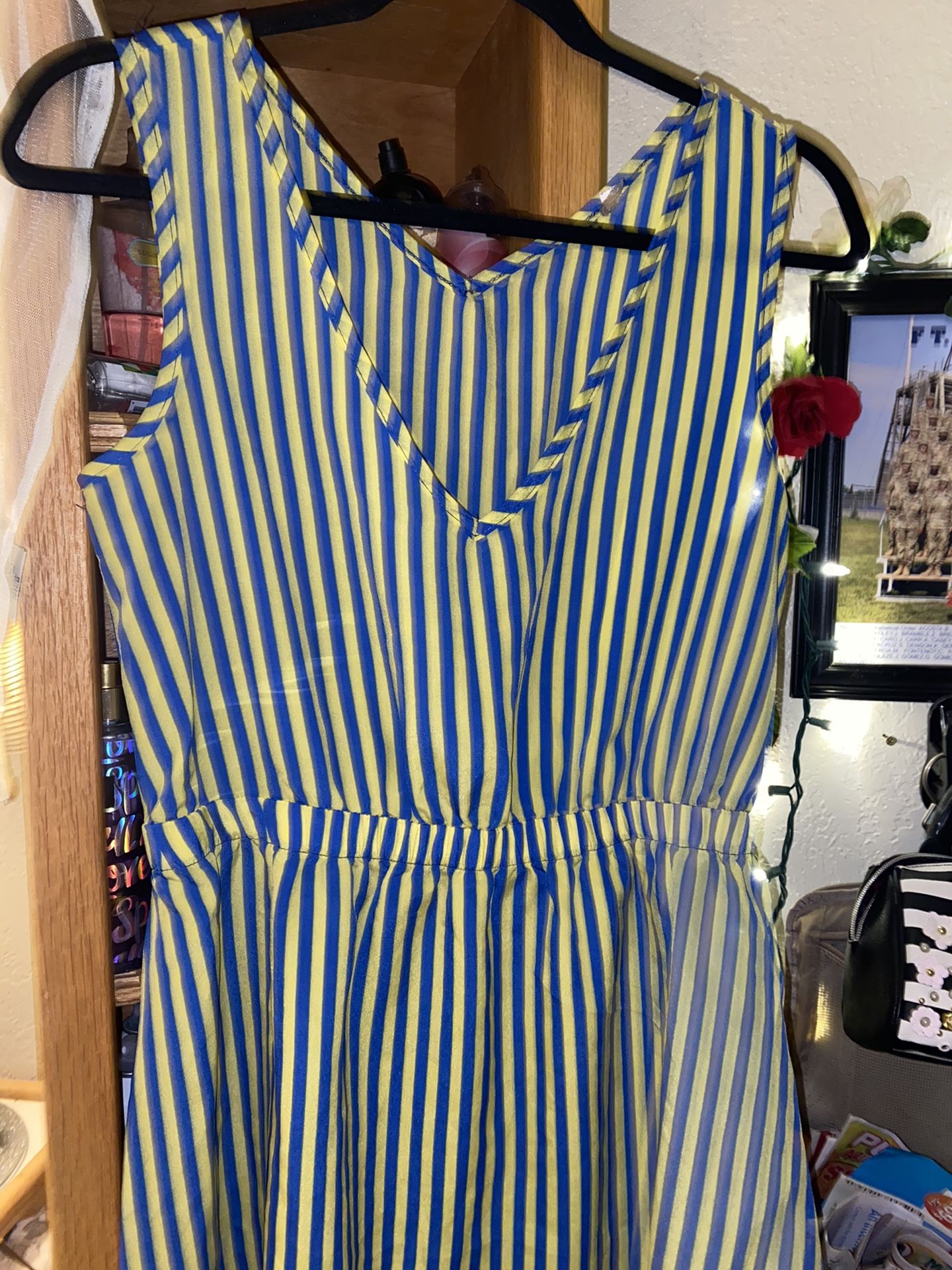 Preowned woman’s size M yellow/blue dress in great condition but a bit see through located off lake mead and jones area asking $3