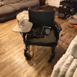 Wheelchair with arm table