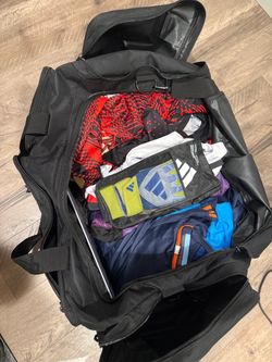 Soccer duffle bag, soccer uniforms, goalie gloves