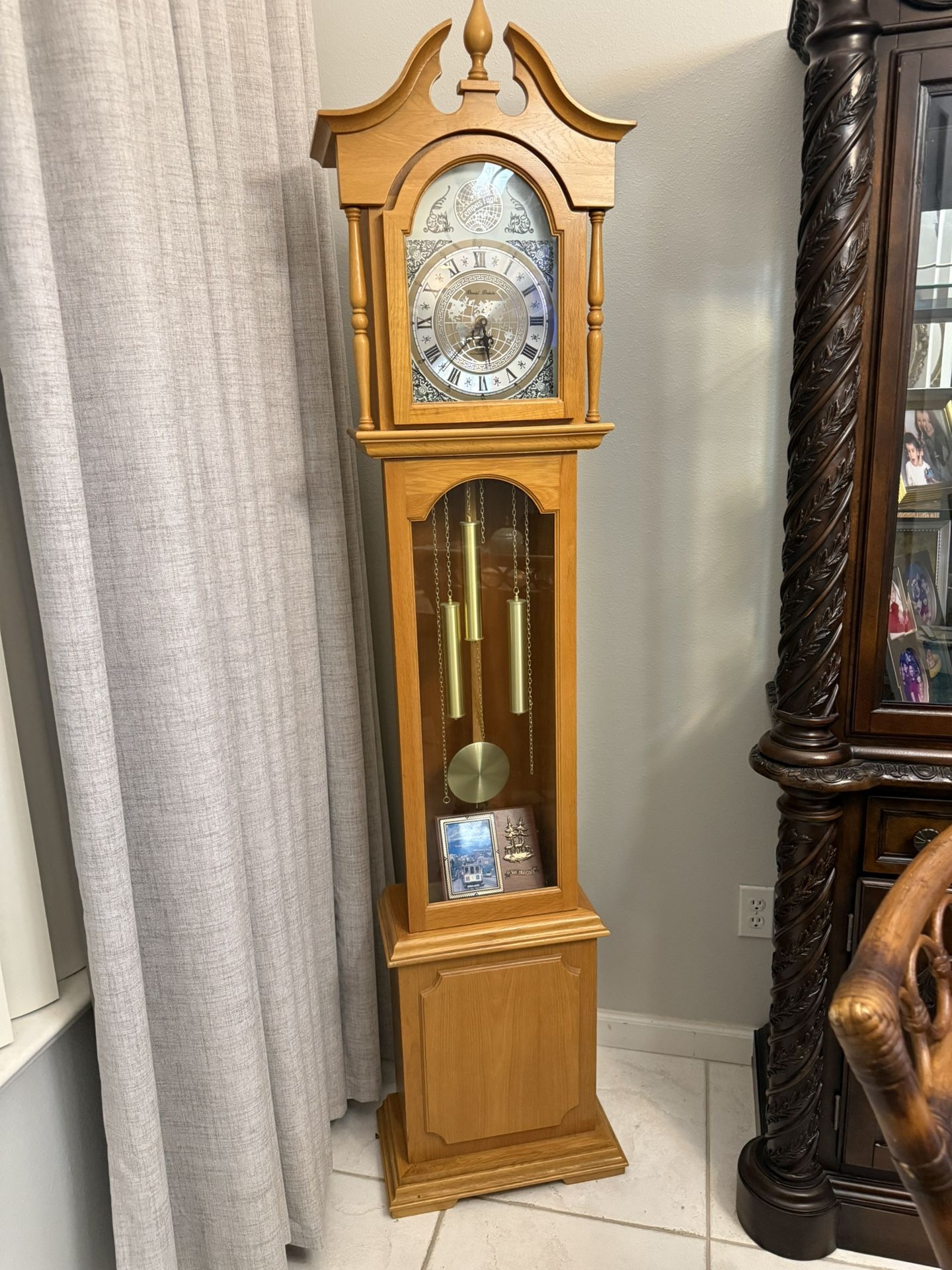 Vintage Traditional Grandfather clock in light wood finish.