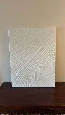 This is a white 3D textured plaster canvas painting featuring a minimalist wave or ripple design