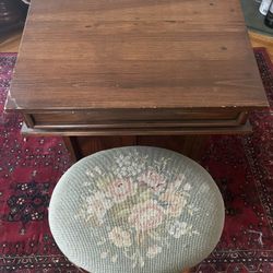 Antique desk with embroidered cushion stool