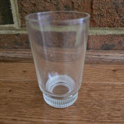 Vintage Glass Juice Cup with Ribbed Pattern Around the Recessed Bottom of the Cupp