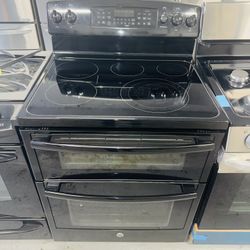 GE black electric stove with double oven, receipt with 60-day warranty