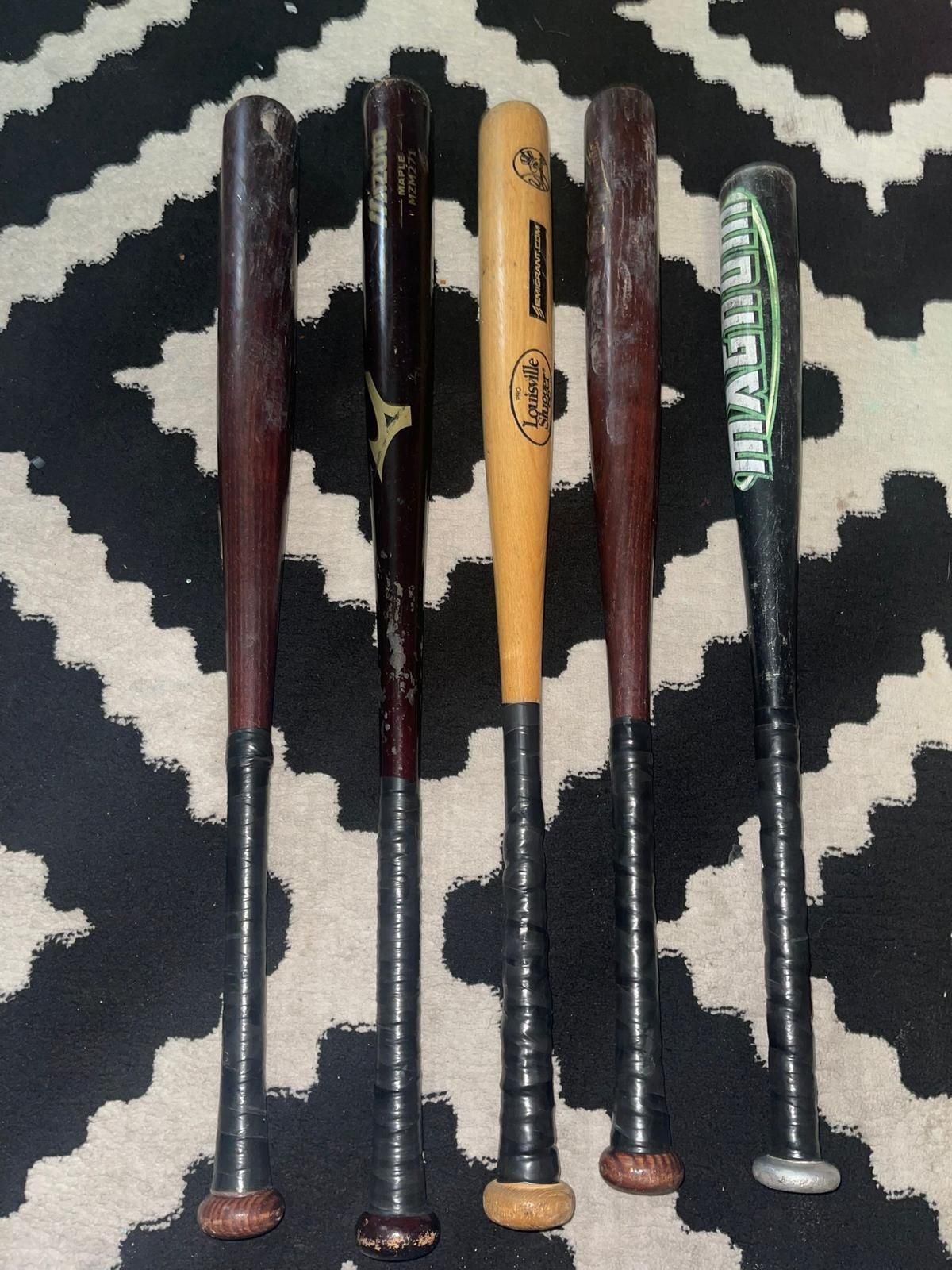 5 baseball bats, 4 wooden and 1 aluminum, in good condition, I am not selling them separately.