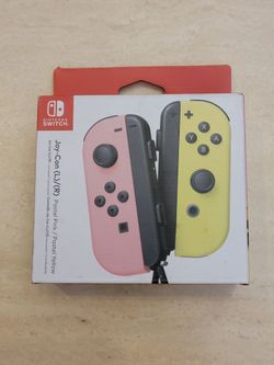 Brand new never opened Nintendo Switch Pastel Yellow & Pastel Pink Joycons in sealed box for $65