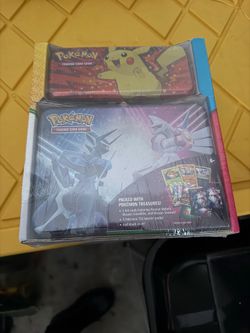 pokémon trading card game tin 2-pack with pikachu, dialga, and palkia